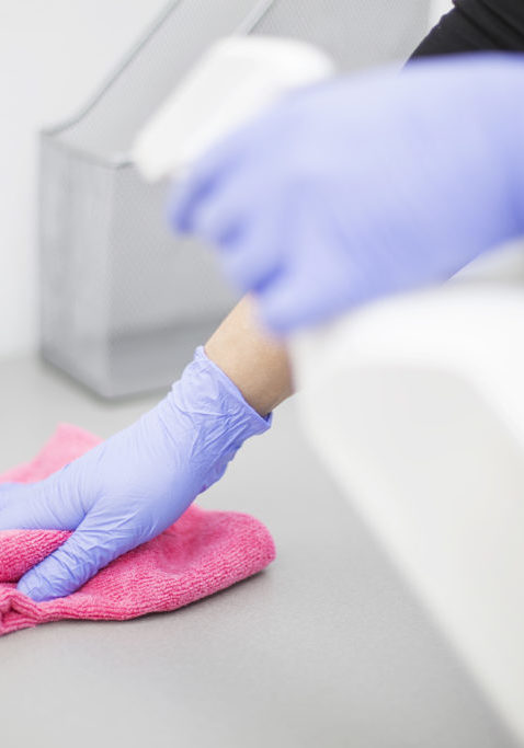 Woman at work, professional maid cleaning in dental office